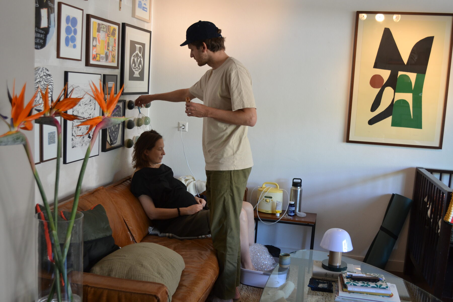Father gives mother a tincture during recovery